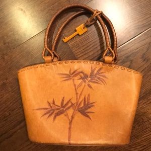 Brown leather purse with bamboo detail